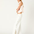 WHITE COWBOY STUDDED JEANS