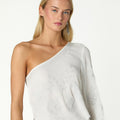 RAW ASYMMETRICAL EMBROIDERED TOP