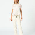 White flared denim pants