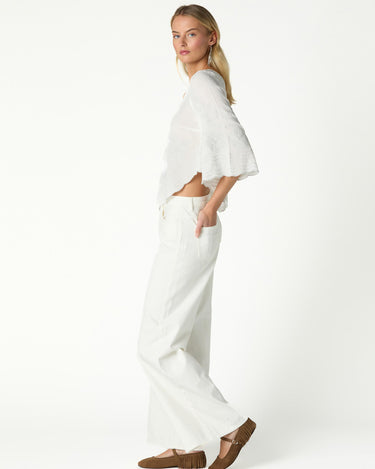 RAW ASYMMETRICAL EMBROIDERED TOP