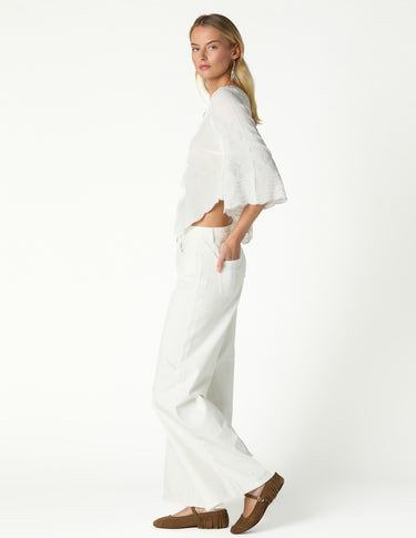 RAW ASYMMETRICAL EMBROIDERED TOP