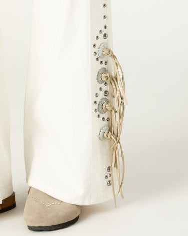 WHITE COWBOY STUDDED JEANS
