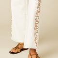 WHITE PANTS WITH EMBROIDERED TRIM