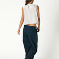 WHITE RUFFLED SLEEVELESS TOP